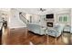 A spacious living room with a cozy fireplace, hardwood floors, and modern furnishings offers a relaxing retreat at 2638 Clairmont Rd, Atlanta, GA 30329
