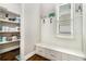 Mudroom features storage bench with drawers, hooks, and a view to the pantry at 2638 Clairmont Rd, Atlanta, GA 30329