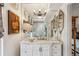 Stylish bathroom featuring a marble vanity, mirrored wall, modern lighting, and decorative accents at 275 13Th Ne St # 201, Atlanta, GA 30309