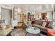 Bright living room featuring a comfortable sectional sofa and stylish decor at 275 13Th Ne St # 201, Atlanta, GA 30309