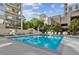 Inviting outdoor pool surrounded by lounge chairs and lush landscaping at 275 13Th Ne St # 201, Atlanta, GA 30309