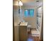 Classic bathroom with white shiplap walls, modern fixtures and patterned shower curtain at 406 S Hillcrest Sw Dr, Marietta, GA 30064