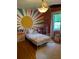 A bedroom, featuring colorful wall art, hardwood floors, and a cozy area rug at 406 S Hillcrest Sw Dr, Marietta, GA 30064