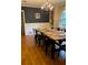 Traditional dining room featuring hardwood floors, chandelier, and a large wooden table perfect for Gathering gatherings at 406 S Hillcrest Sw Dr, Marietta, GA 30064