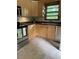 Well-maintained kitchen with stainless steel appliances, wood cabinets and tile floors, perfect for everyday meals at 406 S Hillcrest Sw Dr, Marietta, GA 30064