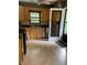 Charming kitchen with stainless steel appliances, wood cabinets and tile floors, ideal for cooking and entertaining at 406 S Hillcrest Sw Dr, Marietta, GA 30064