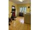 Laundry room with modern machines, a storage rack, red door, and large window at 406 S Hillcrest Sw Dr, Marietta, GA 30064