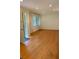 Spacious living room with gleaming hardwood floors and abundant natural light at 406 S Hillcrest Sw Dr, Marietta, GA 30064