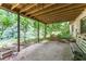 Outdoor back patio with bench and wood swing at 4714 Darlene Way, Tucker, GA 30084