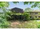 Backyard with green trees and patio at 4714 Darlene Way, Tucker, GA 30084