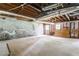 Unfinished basement featuring exposed beams and concrete walls at 4714 Darlene Way, Tucker, GA 30084