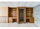 Basement desks between shelving units with a view to a storage room at 4714 Darlene Way, Tucker, GA 30084