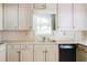 Functional kitchen with white cabinetry, countertops and a built-in dishwasher at 4714 Darlene Way, Tucker, GA 30084