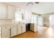 Bright kitchen with white cabinets and checkered flooring and ample counter space at 4714 Darlene Way, Tucker, GA 30084
