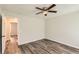 Bedroom featuring wood-look flooring and an open doorway at 7127 Greenway Sw Cv, Covington, GA 30014