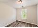 Bedroom featuring wood-look flooring and one window at 7127 Greenway Sw Cv, Covington, GA 30014