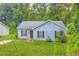 Charming single-story home featuring a well-maintained lawn and traditional architectural details at 7127 Greenway Sw Cv, Covington, GA 30014