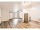 Open concept kitchen featuring stainless steel appliances and hardwood style floors at 7127 Greenway Sw Cv, Covington, GA 30014