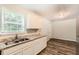 Functional kitchen featuring granite countertops and ample cabinet space for storage at 7127 Greenway Sw Cv, Covington, GA 30014