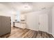 Open concept kitchen features stainless steel appliances and stylish flooring at 7127 Greenway Sw Cv, Covington, GA 30014
