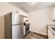 Modern kitchen with stainless steel appliances, granite countertops and new cabinets at 7127 Greenway Sw Cv, Covington, GA 30014