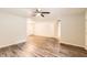 Spacious living room features stylish flooring and access to multiple rooms at 7127 Greenway Sw Cv, Covington, GA 30014