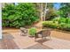 Brick patio with outdoor seating area and view of lush green landscape at 1000 Gunter Ct, Alpharetta, GA 30022
