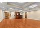 Finished basement featuring a wet bar, hardwood flooring and recessed lighting at 1000 Gunter Ct, Alpharetta, GA 30022