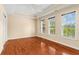 Sunlit bedroom with hardwood floors and large windows at 1000 Gunter Ct, Alpharetta, GA 30022