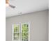 This is a bedroom with carpet, neutral walls, a ceiling fan, and a window at 1000 Gunter Ct, Alpharetta, GA 30022