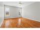 Bright bedroom with hardwood floors and a ceiling fan at 1000 Gunter Ct, Alpharetta, GA 30022