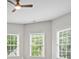 Bedroom featuring natural light from large windows and a ceiling fan at 1000 Gunter Ct, Alpharetta, GA 30022