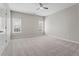 Spacious bedroom with two windows and a ceiling fan at 1000 Gunter Ct, Alpharetta, GA 30022