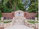 Stone and brick entrance to Kimball Farms community with stone pavers and manicured landscaping surrounding the welcome sign at 1000 Gunter Ct, Alpharetta, GA 30022