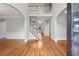 Welcoming foyer showcasing hardwood floors, white trim and grand stairway at 1000 Gunter Ct, Alpharetta, GA 30022