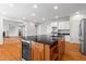 Kitchen island with a built-in wine cooler and storage at 1000 Gunter Ct, Alpharetta, GA 30022
