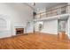 Spacious living room featuring a fireplace and hardwood floors at 1000 Gunter Ct, Alpharetta, GA 30022