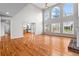 Bright living room boasting tall windows and beautiful hardwood flooring at 1000 Gunter Ct, Alpharetta, GA 30022