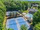 Aerial view of community tennis courts, swimming pool, and clubhouse at 1000 Gunter Ct, Alpharetta, GA 30022