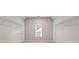 Large walk-in closet with ample space, shelving, neutral walls, carpet, and a window at 1000 Gunter Ct, Alpharetta, GA 30022