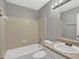 Bathroom featuring a tiled shower-tub combo, a single sink vanity, and a toilet at 1234 Wellhouse Walk, Stone Mountain, GA 30088