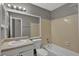 Bathroom featuring a tiled shower-tub combo, a single sink vanity, and a toilet at 1234 Wellhouse Walk, Stone Mountain, GA 30088