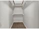 A walk-in closet provides efficient storage space with shelving and racks at 1234 Wellhouse Walk, Stone Mountain, GA 30088
