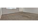 Carpeted living room offers ample space and natural light at 1234 Wellhouse Walk, Stone Mountain, GA 30088