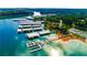 Beautiful aerial view of covered boat slips and marina on a scenic lake surrounded by mature trees at 2540 Ridgehurst Dr, Buford, GA 30518
