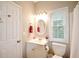 Bright, functional bathroom featuring a white vanity, toilet, shower/tub, and window with natural light at 2540 Ridgehurst Dr, Buford, GA 30518