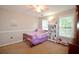 Bedroom features a ceiling fan and two windows providing natural light at 2540 Ridgehurst Dr, Buford, GA 30518
