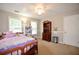 Cozy bedroom features a ceiling fan and two windows providing natural light at 2540 Ridgehurst Dr, Buford, GA 30518