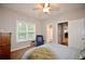 Bedroom features carpet, ceiling fan, and ensuite bathroom at 2540 Ridgehurst Dr, Buford, GA 30518