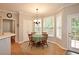 Bright breakfast nook features a round table, chandelier lighting, and large windows with views to the outside deck at 2540 Ridgehurst Dr, Buford, GA 30518